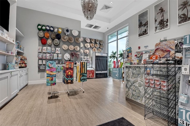 720 Gardenia Ln, Davenport, FL 33897 - recreation room featuring wood finished floors and a chandelier