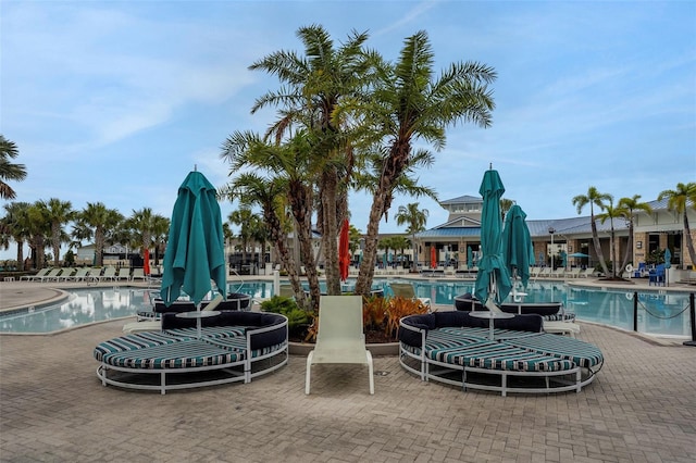 720 Gardenia Ln, Davenport, FL 33897 - community pool featuring a patio area