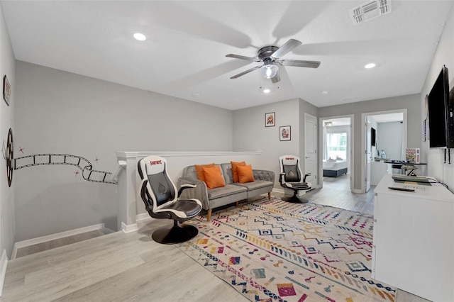 720 Gardenia Ln, Davenport, FL 33897 - living room with light wood-style flooring, ceiling fan, and recessed lighting