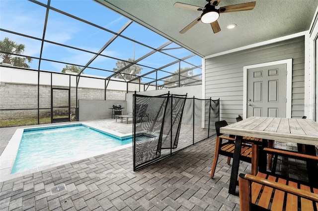 720 Gardenia Ln, Davenport, FL 33897 - view of swimming pool featuring a patio area, ceiling fan, outdoor dining space, and glass enclosure