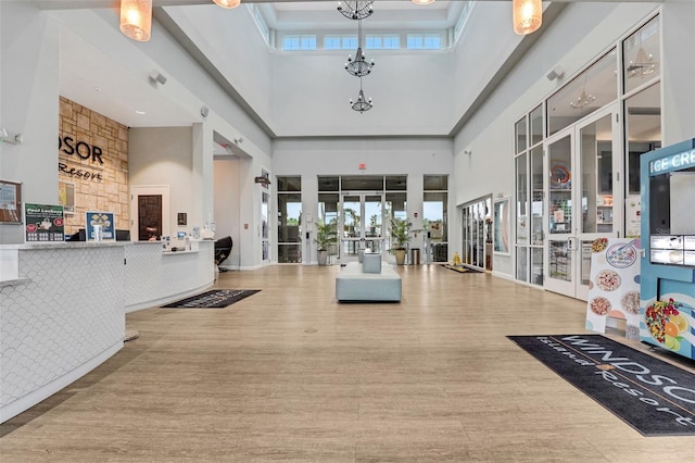 720 Gardenia Ln, Davenport, FL 33897 - welcome area featuring a towering ceiling, french doors, and a chandelier