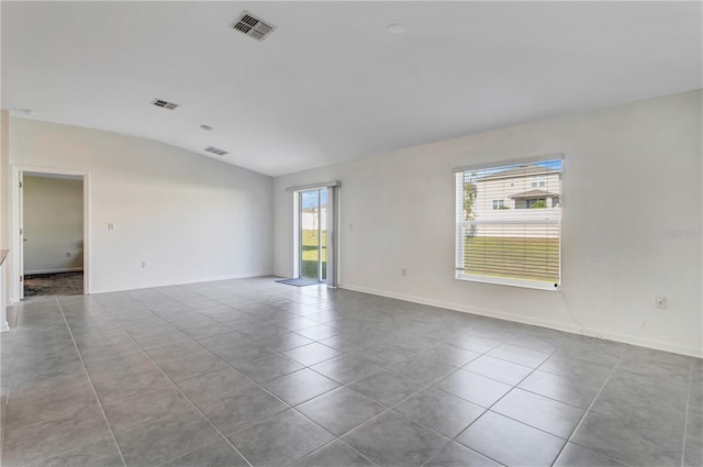 865 Citrus Reserve Blvd, Davenport, FL 33837 - unfurnished room with lofted ceiling, tile patterned flooring, and baseboards