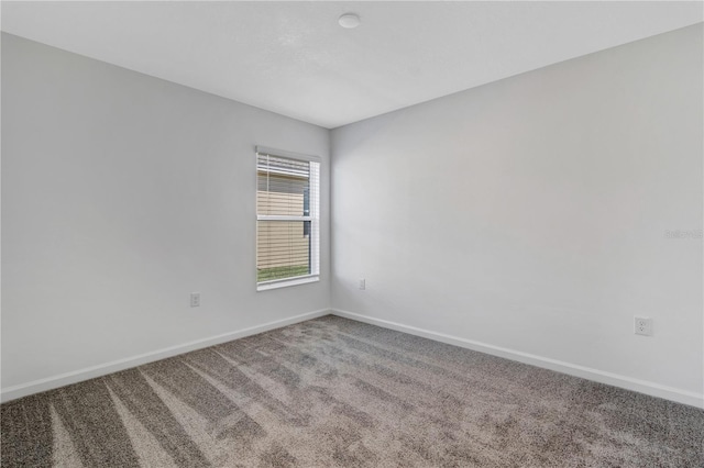 865 Citrus Reserve Blvd, Davenport, FL 33837 - empty room with baseboards and carpet floors