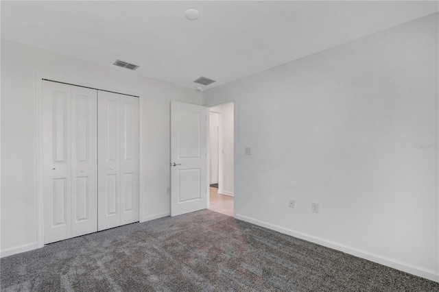 865 Citrus Reserve Blvd, Davenport, FL 33837 - unfurnished bedroom featuring carpet, baseboards, and a closet