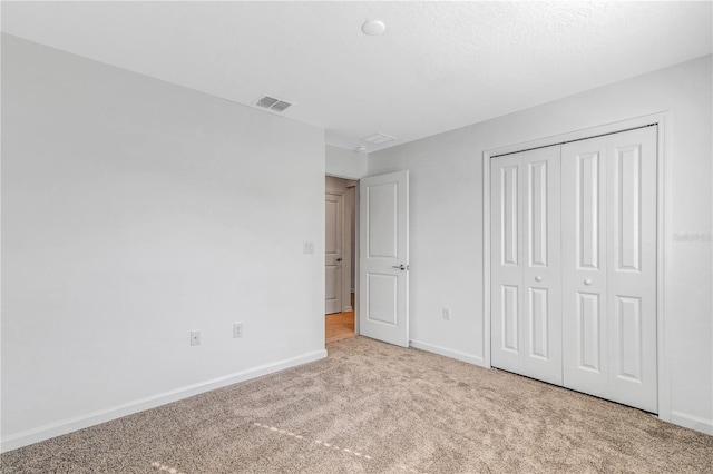 865 Citrus Reserve Blvd, Davenport, FL 33837 - unfurnished bedroom featuring carpet flooring, baseboards, and a closet