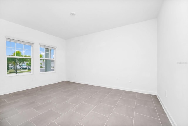 1596 Contentment Loop, Kissimmee, FL 34744 - empty room featuring baseboards