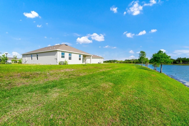 1596 Contentment Loop, Kissimmee, FL 34744 - view of green lawn with a water view