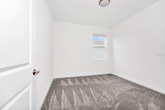 1596 Contentment Loop, Kissimmee, FL 34744 - spare room with carpet floors and baseboards