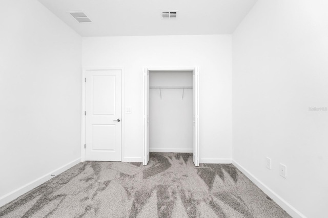 1596 Contentment Loop, Kissimmee, FL 34744 - unfurnished bedroom with carpet flooring, baseboards, and a closet