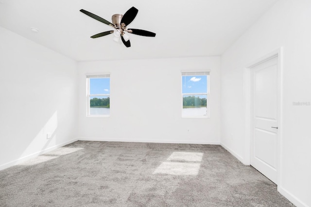 1596 Contentment Loop, Kissimmee, FL 34744 - unfurnished room with carpet floors, a ceiling fan, and baseboards