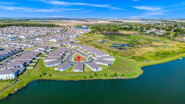1596 Contentment Loop, Kissimmee, FL 34744 - aerial overview of property's location with nearby suburban area and a nearby body of water
