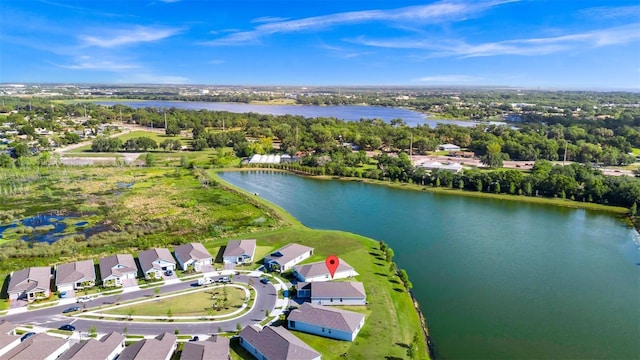 1596 Contentment Loop, Kissimmee, FL 34744 - aerial perspective of suburban area featuring a nearby body of water and a tree filled landscape