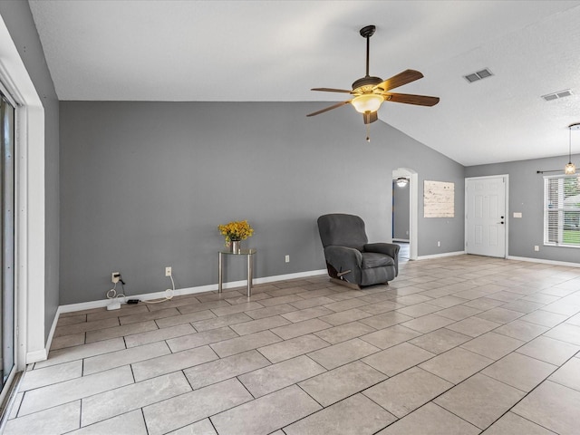 112 Lake Butler Ave, Haines City, FL 33844 - unfurnished room with ceiling fan, vaulted ceiling, baseboards, and light tile patterned floors