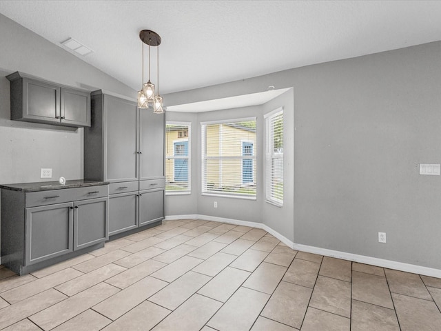 112 Lake Butler Ave, Haines City, FL 33844 - unfurnished dining area with baseboards and light tile patterned floors
