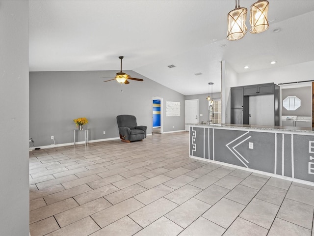 112 Lake Butler Ave, Haines City, FL 33844 - kitchen featuring a ceiling fan, lofted ceiling, pendant lighting, a sink, and baseboards