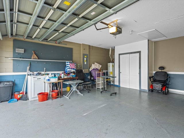 112 Lake Butler Ave, Haines City, FL 33844 - garage featuring concrete block wall, a garage door opener, water heater, and electric panel