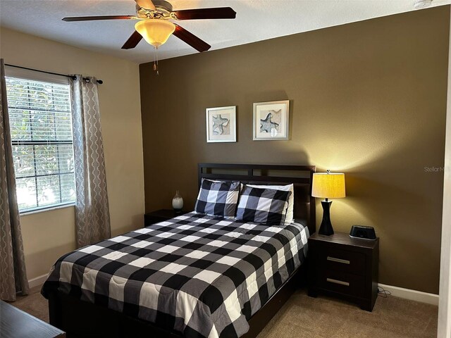 1439 Moon Valley Dr, Davenport, FL 33896 - carpeted bedroom with multiple windows, baseboards, and ceiling fan