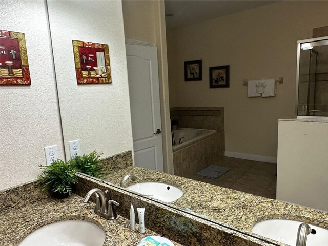 1439 Moon Valley Dr, Davenport, FL 33896 - bathroom with double vanity, a garden tub, tile patterned flooring, and a shower with shower door