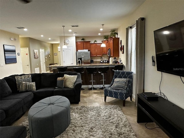 1439 Moon Valley Dr, Davenport, FL 33896 - living area featuring light tile patterned floors and recessed lighting