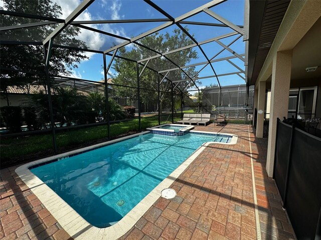 1439 Moon Valley Dr, Davenport, FL 33896 - view of pool with a patio area, a pool with connected hot tub, and glass enclosure