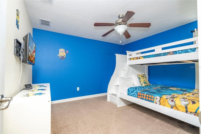 1439 Moon Valley Dr, Davenport, FL 33896 - carpeted bedroom featuring baseboards, ceiling fan, and a textured ceiling