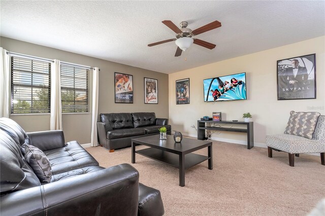 1439 Moon Valley Dr, Davenport, FL 33896 - living area featuring ceiling fan, light carpet, a textured ceiling, and baseboards