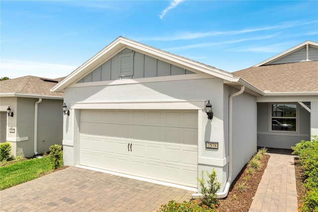2578 Cliff Way, Saint Cloud, FL 34771 - ranch-style home with an attached garage, decorative driveway, roof with shingles, and stucco siding
