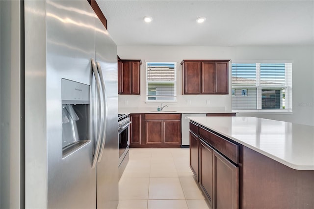 2578 Cliff Way, Saint Cloud, FL 34771 - kitchen with appliances with stainless steel finishes, a sink, light countertops, plenty of natural light, and recessed lighting