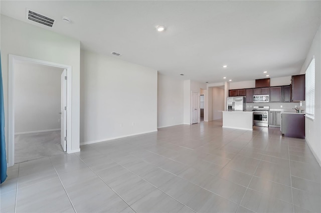 2578 Cliff Way, Saint Cloud, FL 34771 - unfurnished living room featuring recessed lighting, light tile patterned flooring, baseboards, and a sink