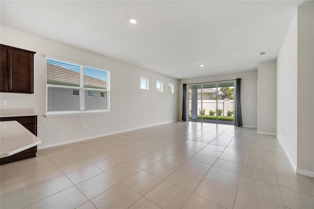 2578 Cliff Way, Saint Cloud, FL 34771 - spare room featuring light tile patterned floors, baseboards, and recessed lighting