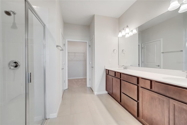 2578 Cliff Way, Saint Cloud, FL 34771 - bathroom with a shower stall, double vanity, and a walk in closet