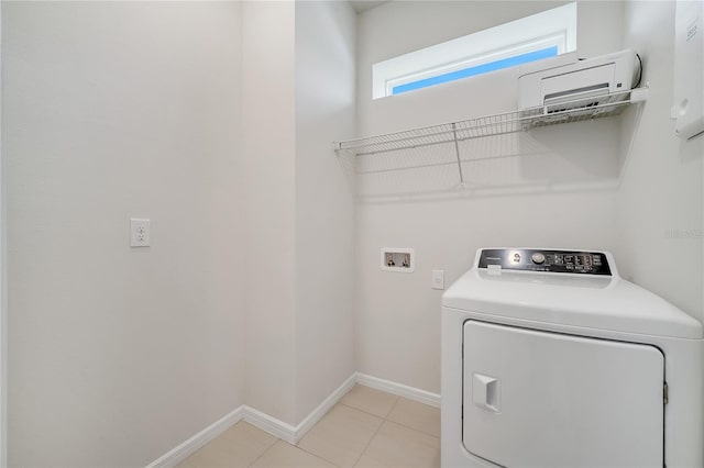 2578 Cliff Way, Saint Cloud, FL 34771 - laundry area with washer / dryer, baseboards, and light tile patterned floors