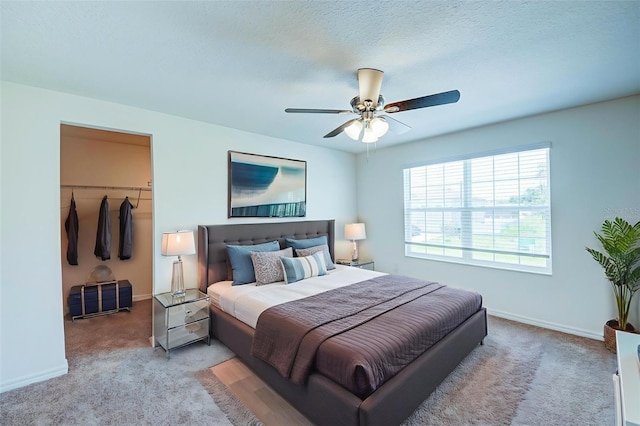 1303 Congo Ct, Kissimmee, FL 34759 - carpeted bedroom with a walk in closet, a closet, and ceiling fan