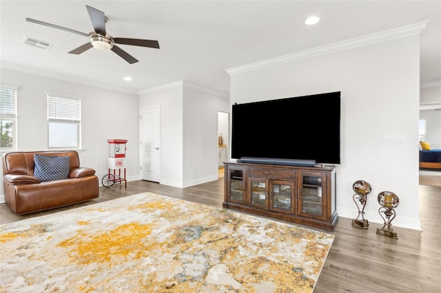 9844 Beach Port Dr, Winter Garden, FL 34787 - living area with wood finished floors, ceiling fan, ornamental molding, baseboards, and recessed lighting