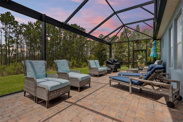 9844 Beach Port Dr, Winter Garden, FL 34787 - patio terrace at dusk with a patio area, glass enclosure, an outdoor hangout area, and area for grilling