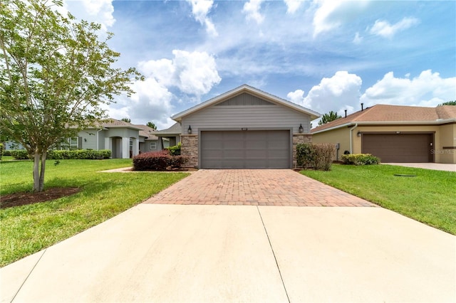 3651 NW 56th Ave, Ocala, FL 34482 - ranch-style home featuring decorative driveway, an attached garage, and a front yard
