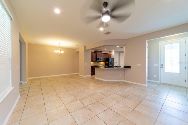 3651 NW 56th Ave, Ocala, FL 34482 - unfurnished living room with a chandelier, light tile patterned floors, a sink, ceiling fan, and baseboards