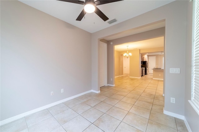 3651 NW 56th Ave, Ocala, FL 34482 - spare room featuring a chandelier, light tile patterned floors, ceiling fan, and baseboards