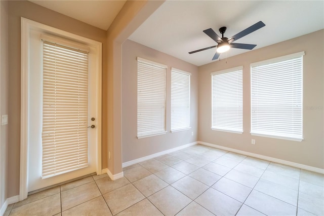 3651 NW 56th Ave, Ocala, FL 34482 - unfurnished room featuring light tile patterned floors, a ceiling fan, and baseboards
