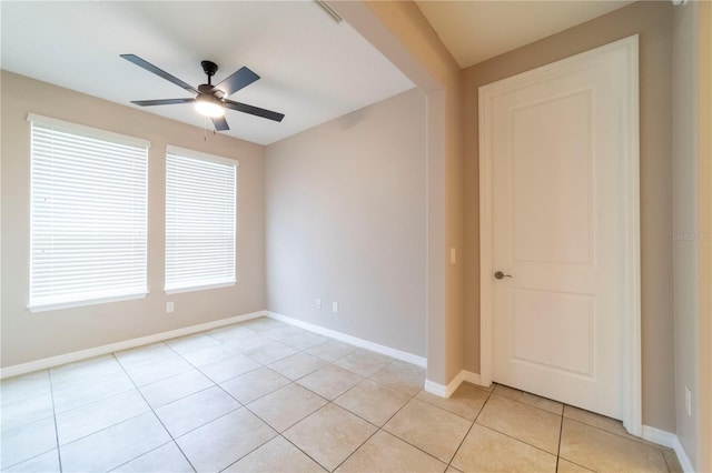 3651 NW 56th Ave, Ocala, FL 34482 - unfurnished room featuring light tile patterned flooring, a ceiling fan, and baseboards
