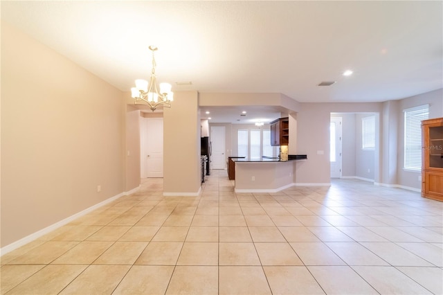 3651 NW 56th Ave, Ocala, FL 34482 - unfurnished living room with a chandelier, light tile patterned floors, recessed lighting, and baseboards