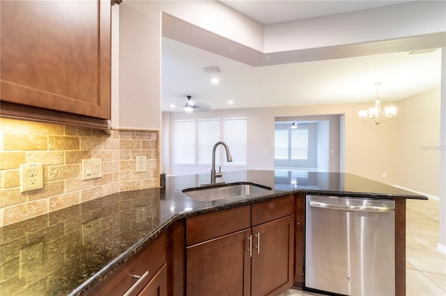3651 NW 56th Ave, Ocala, FL 34482 - kitchen featuring dishwasher, a sink, dark stone counters, decorative backsplash, and light tile patterned floors