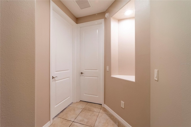 3651 NW 56th Ave, Ocala, FL 34482 - corridor with light tile patterned flooring and baseboards