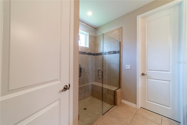 3651 NW 56th Ave, Ocala, FL 34482 - bathroom featuring a shower stall, tile patterned floors, and baseboards