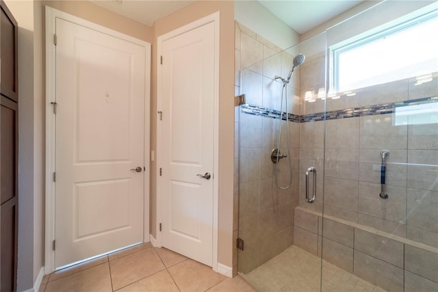3651 NW 56th Ave, Ocala, FL 34482 - full bath featuring a stall shower, tile patterned flooring, and baseboards
