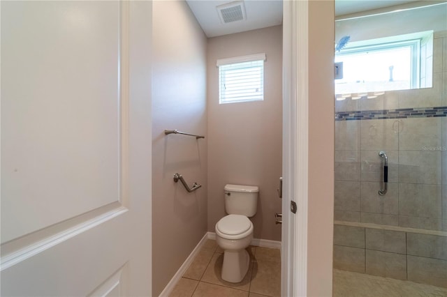 3651 NW 56th Ave, Ocala, FL 34482 - bathroom featuring toilet, a shower stall, tile patterned flooring, and baseboards