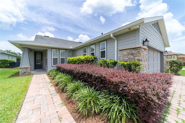 3651 NW 56th Ave, Ocala, FL 34482 - view of front facade with stone siding and a front lawn