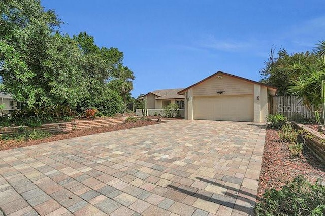 9319 Woodbreeze Blvd, Windermere, FL 34786 - view of front of house featuring a garage and decorative driveway