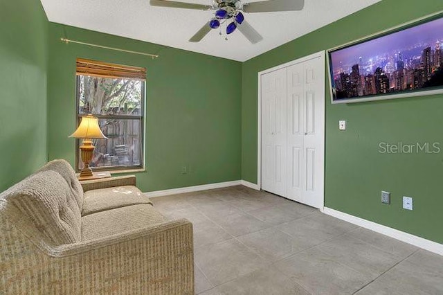 9319 Woodbreeze Blvd, Windermere, FL 34786 - living area with ceiling fan and baseboards