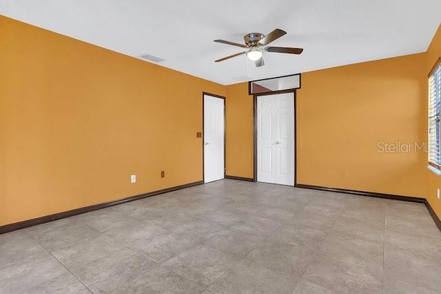 9319 Woodbreeze Blvd, Windermere, FL 34786 - unfurnished room with a ceiling fan and baseboards